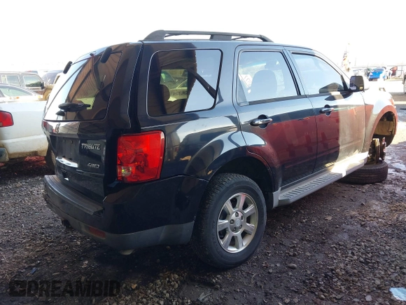 2011 Mazda Tribute Sport with VIN 4F2CY9C7XBKM06202, listed as a IAAI auction lot 41281197 with 195,443 mi miles and . Bid and sale history available at DreamBid. Image 4.