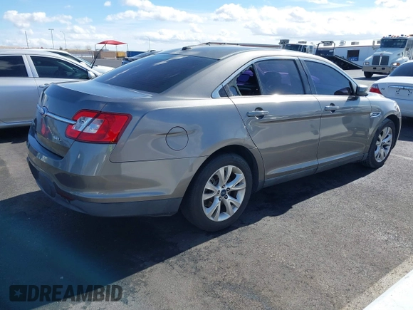 2011 Ford Taurus SEL with VIN 1FAHP2EW9BG158991, listed as a IAAI auction lot 41530132 with 153,323 mi miles. Bid and sale history available at carsss.com. Image 4.