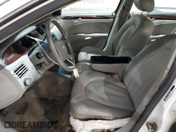 2010 Buick Lucerne CXL with VIN 1G4HC5EM8AU106608, listed as a Copart auction lot 49465595 with 98,789 mi miles and Salvage Title. Bid and sale history available at DreamBid. Image 7.