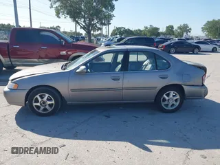 1999 Nissan Altima XE with VIN 1N4DL01D1XC255927, listed as a IAAI auction lot 42003101 with 154,000 mi miles. Bid and sale history available at carsss.com. Image 14.