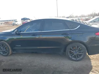 2018 Ford Fusion Hybrid SE with VIN 3FA6P0LUXJR131707, listed as a IAAI auction lot 41490634 with 129,500 mi miles. Bid and sale history available at carsss.com. Image 14.