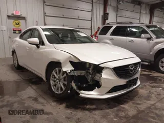 2016 Mazda Mazda6 i Sport with VIN JM1GJ1U54G1473671, listed as a IAAI auction lot 41576038 with 88,386 mi miles. Bid and sale history available at carsss.com. Image 1.