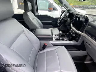 2022 Ford F-150 Lightning Pro z VIN 1FTVW1ELXNWG14877, wystawiony jako IAAI lot #42302068 z przebiegiem 10 264 mil mil oraz . Historia ofert i sprzedaży dostępna na DreamBid. Obrazek 1.