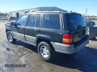 1996 Jeep Grand Cherokee Laredo with VIN 1J4GZ58S9TC268615, listed as a IAAI auction lot 41527984 with 248,443 mi miles. Bid and sale history available at carsss.com. Image 3.