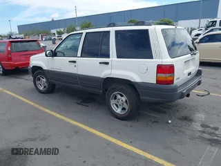 1996 Jeep Grand Cherokee Laredo with VIN 1J4FX58S5TC388512, listed as a IAAI auction lot 42803796 with 147,732 mi miles and . Bid and sale history available at DreamBid. Image 3.