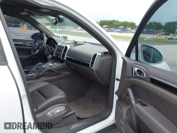 2016 Porsche Cayenne S E-Hybrid with VIN WP1AE2A25GLA63698, listed as a IAAI auction lot 42694555 with 141,957 mi miles and . Bid and sale history available at DreamBid. Image 5.