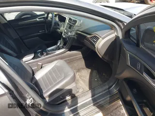 2015 Ford Fusion SE z VIN 3FA6P0H98FR275848, wystawiony jako IAAI lot #42311852 z przebiegiem 197 536 mil mil oraz . Historia ofert i sprzedaży dostępna na DreamBid. Obrazek 5.