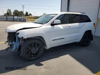 2020 Jeep Grand Cherokee Laredo E with VIN 1C4RJFAG1LC142802, listed as a Copart auction lot 60262145 with 74,357 mi miles and Salvage title. Bid and sale history available at DreamBid. Image 1.