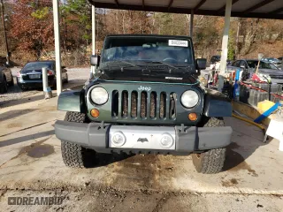 2011 Jeep Wrangler Unlimited Sahara with VIN 1J4BA5H15BL635016, listed as a Copart auction lot 84433444 with 124,217 mi miles and Salvage Title. Bid and sale history available at carsss.com. Image 5.