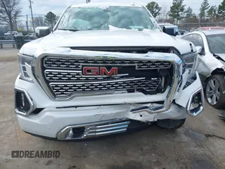 2020 GMC Sierra 1500 Denali z VIN 3GTU9FELXLG371258, wystawiony jako IAAI lot #41303490 z przebiegiem 63 571 mil mil oraz . Historia ofert i sprzedaży dostępna na DreamBid. Obrazek 6.