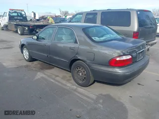 2001 Mazda 626 LX with VIN 1YVGF22C815218444, listed as a IAAI auction lot 41940404 with 143,080 mi miles. Bid and sale history available at carsss.com. Image 3.