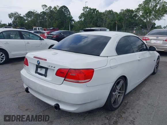 2007 BMW 3 Series 335i with VIN WBAWL73567PX46744, listed as a IAAI auction lot 39120411 with 159,526 mi miles. Bid and sale history available at carsss.com. Image 4.