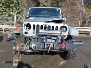 2011 Jeep Wrangler Rubicon with VIN 1J4BA6D10BL514776, listed as a IAAI auction lot 41487396 with 172,208 mi miles. Bid and sale history available at carsss.com. Image 13.