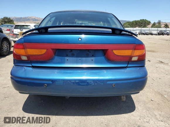 2000 Saturn SL with VIN 1G8ZK5271YZ184701, listed as a Copart auction lot 61598135 with 123,309 mi miles and Salvage title. Bid and sale history available at DreamBid. Image 6.