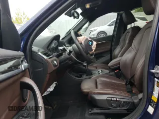 2018 BMW X1 xDrive28i with VIN WBXHT3C35J5F88893, listed as a Copart auction lot 58032725 with 143,968 mi miles and Salvage title. Bid and sale history available at DreamBid. Image 7.