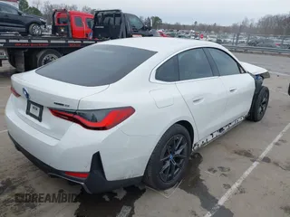 2023 BMW i4 eDrive35 z VIN WBY43AW04PFP70309, wystawiony jako IAAI lot #41745911 z przebiegiem 15 453 mil mil oraz . Historia ofert i sprzedaży dostępna na DreamBid. Obrazek 4.