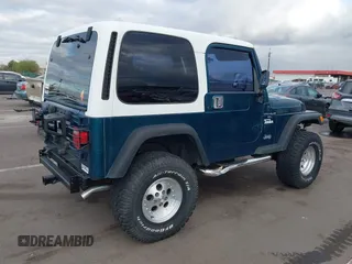 1998 Jeep Wrangler Sport with VIN 1J4FY19S7WP787679, listed as a IAAI auction lot 41764883 with 134,144 mi miles. Bid and sale history available at carsss.com. Image 4.