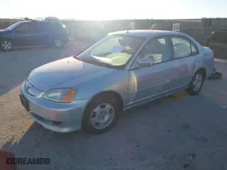 2003 Honda Civic Hybrid with VIN JHMES956X3S019115, listed as a IAAI auction lot 41214960 with 303,472 mi miles. Bid and sale history available at carsss.com. Image 2.