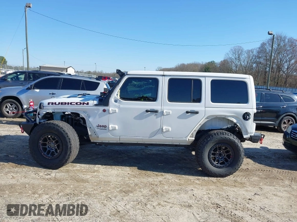 2022 Jeep Wrangler Unlimited Rubicon z VIN 1C4JJXFGXNW121489, wystawiony jako IAAI lot #41749550 z przebiegiem 56 601 mil mil oraz . Historia ofert i sprzedaży dostępna na DreamBid. Obrazek 6.