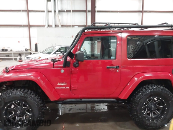 2011 Jeep Wrangler Sahara with VIN 1J4AA5D10BL593534, listed as a IAAI auction lot 41551416 with 101,716 mi miles and . Bid and sale history available at DreamBid. Image 14.