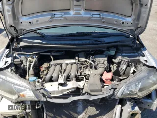 2015 Honda Fit EX-L z VIN 3HGGK5H86FM712830, wystawiony jako Copart lot #56429325 z przebiegiem 150 397 mil mil oraz Szkoda całkowita • Salvage title. Historia ofert i sprzedaży dostępna na DreamBid. Obrazek 11.