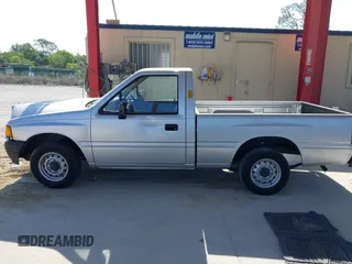 1990 Isuzu Pickup S z VIN JAACL11L6L7206171, wystawiony jako IAAI lot #42214364 z przebiegiem 75 057 mil mil oraz . Historia ofert i sprzedaży dostępna na DreamBid. Obrazek 14.
