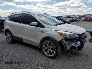 2015 Ford Escape Titanium z VIN 1FMCU9J90FUC41606, wystawiony jako Copart lot #57458455 z przebiegiem 71 671 mil mil oraz Szkoda całkowita • Salvage title. Historia ofert i sprzedaży dostępna na DreamBid. Obrazek 4.