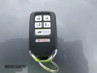 2014 Honda Odyssey Touring with VIN 5FNRL5H9XEB073156, listed as a IAAI auction lot 41990714 with 166,129 mi miles and . Bid and sale history available at DreamBid. Image 11.