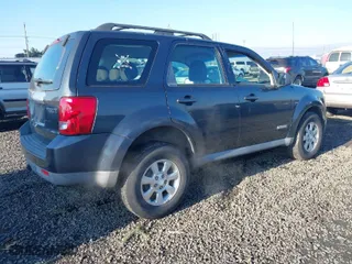 2008 Mazda Tribute Touring with VIN 4F2CZ96168KM05738, listed as a IAAI auction lot 41403675 with 217,593 mi miles. Bid and sale history available at carsss.com. Image 4.