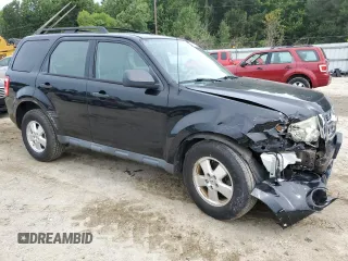 2012 Ford Escape XLS with VIN 1FMCU9C71CKA30319, listed as a Copart auction lot 60189745 with 214,736 mi miles and Salvage title. Bid and sale history available at DreamBid. Image 4.