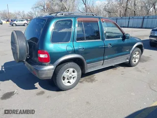 2002 Kia Sportage with VIN KNDJA723925120001, listed as a IAAI auction lot 41931419 with 145,675 mi miles. Bid and sale history available at carsss.com. Image 4.