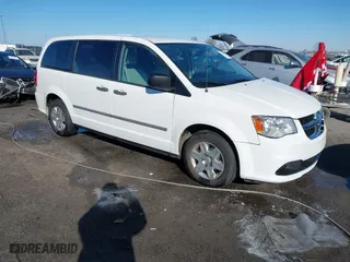 2012 Dodge Grand Caravan SE with VIN 2C4RDGBG1CR243115, listed as a IAAI auction lot 41279782 with 113,860 mi miles. Bid and sale history available at carsss.com. Image 1.