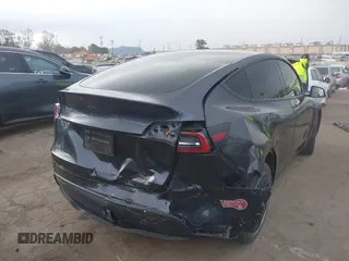 2024 Tesla Model Y with VIN 7SAYGDED8RF116209, listed as a IAAI auction lot 41761804 with 12,048 mi miles and . Bid and sale history available at DreamBid. Image 4.