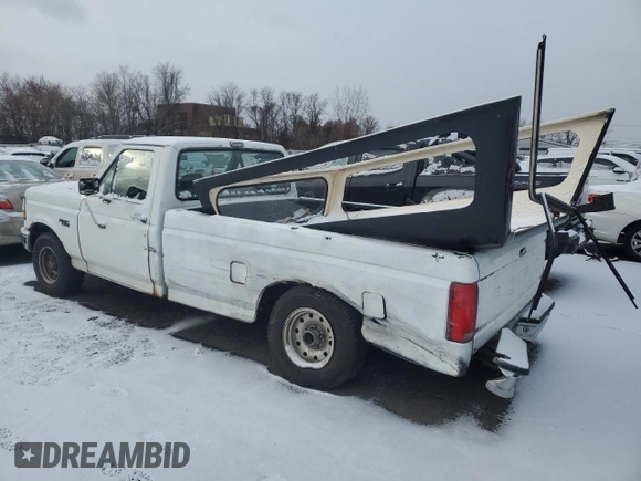 1992 Ford F-150 with VIN 2FTDF15Y5NCA31541, listed as a Copart auction lot 85058754 with 138,467 mi miles and Salvage Title. Bid and sale history available at carsss.com. Image 2.