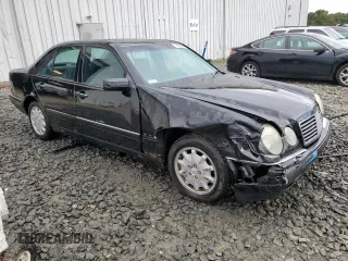 1999 Mercedes-Benz E-Class with VIN WDBJF65H4XA883351, listed as a Copart auction lot 73682964 with 156,446 mi miles and Salvage Title. Bid and sale history available at carsss.com. Image 4.