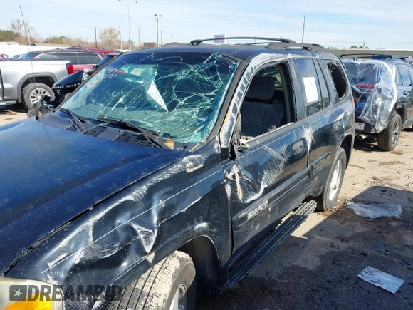 2003 GMC Envoy SLE with VIN 1GKDS13S732134354, listed as a IAAI auction lot 41305506 with 221,733 mi miles. Bid and sale history available at carsss.com. Image 6.