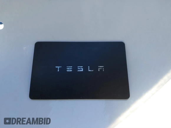2024 Tesla Model Y Long Range with VIN 7SAYGDEEXRF983040, listed as a IAAI auction lot 41555332 with 79,506 mi miles and . Bid and sale history available at DreamBid. Image 11.