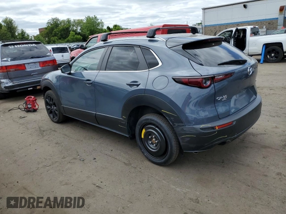 2022 Mazda CX-30 S Carbon Edition with VIN 3MVDMBCL7NM408036, listed as a Copart auction lot 56683665 with 82,337 mi miles and Salvage title. Bid and sale history available at DreamBid. Image 2.