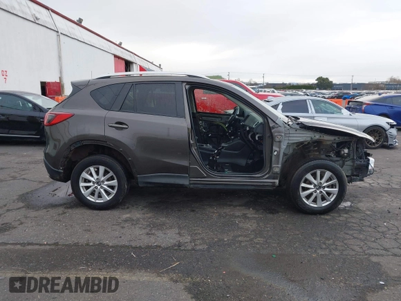 2016 Mazda CX-5 Touring with VIN JM3KE4CY5G0695242, listed as a IAAI auction lot 41795135 with 195,162 mi miles. Bid and sale history available at carsss.com. Image 12.