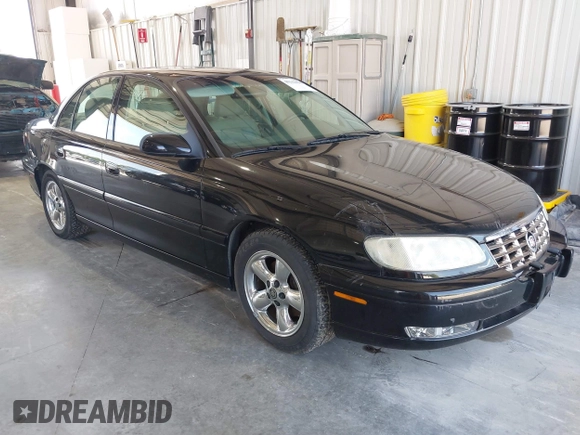 1997 Cadillac Catera z VIN W06VR54R9VR162389, wystawiony jako IAAI lot #40142990 z przebiegiem 111 558 mil mil oraz . Historia ofert i sprzedaży dostępna na DreamBid. Obrazek 1.