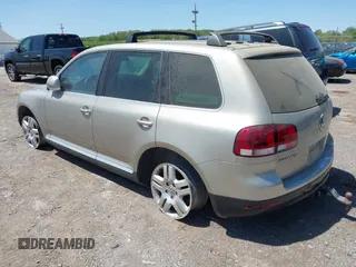 2004 Volkswagen Touareg with VIN WVGCM67L44D033856, listed as a IAAI auction lot 42142143 with 105,682 mi miles and . Bid and sale history available at DreamBid. Image 3.