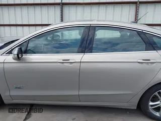 2015 Ford Fusion Energi Titanium with VIN 3FA6P0SU3FR114739, listed as a IAAI auction lot 42003011 with 120,553 mi miles. Bid and sale history available at carsss.com. Image 14.