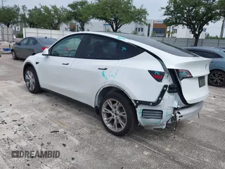 2023 Tesla Model Y Long Range z VIN 7SAYGDEE0PA065534, wystawiony jako IAAI lot #42445868 z przebiegiem 22 638 mil mil oraz . Historia ofert i sprzedaży dostępna na DreamBid. Obrazek 3.