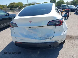 2024 Tesla Model Y with VIN 7SAYGDED9RF161420, listed as a IAAI auction lot 41892788 with 12,353 mi miles and . Bid and sale history available at DreamBid. Image 6.