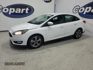 2018 Ford Focus SE z VIN 1FADP3FE9JL244737, wystawiony jako Copart lot #59870205 z przebiegiem 90 534 mil mil oraz Czysty tytuł • Clean title. Historia ofert i sprzedaży dostępna na DreamBid. Obrazek 1.
