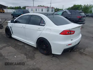 2013 Mitsubishi Lancer Evolution GSR z VIN JA32W8FV0DU023509, wystawiony jako IAAI lot #42222552 z przebiegiem 128 030 mil mil oraz . Historia ofert i sprzedaży dostępna na DreamBid. Obrazek 3.