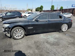2015 BMW 7 Series 740Li with VIN WBAYE4C52FD946831, listed as a Copart auction lot 49014195 with 137,447 mi miles and Salvage Title. Bid and sale history available at DreamBid. Image 1.