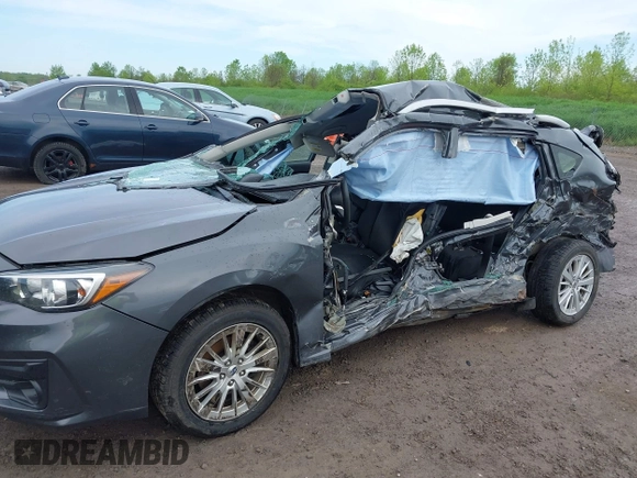 2018 Subaru Impreza Premium z VIN 4S3GTAD67J3701533, wystawiony jako IAAI lot #42157704 z przebiegiem 63 999 mil mil oraz . Historia ofert i sprzedaży dostępna na DreamBid. Obrazek 6.