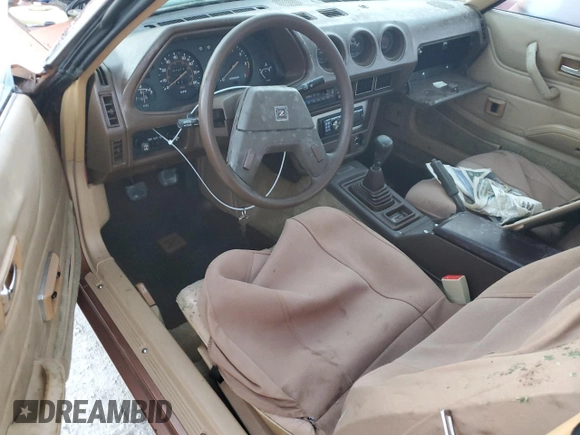 1981 Datsun 280ZX z VIN JN1HZ04SXBX259192, wystawiony jako Copart lot #77847764 z przebiegiem 91 619 mil mil oraz Szkody całkowita. Historia ofert i sprzedaży dostępna na DreamBid. Obrazek 8.