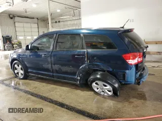 2013 Dodge Journey American Value with VIN 3C4PDCAB4DT581984, listed as a Copart auction lot 59953515 with 166,927 mi miles and Salvage title. Bid and sale history available at DreamBid. Image 2.